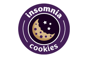 A crescent cookie with stars inside a circle, surrounded by the words "insomnia cookies.