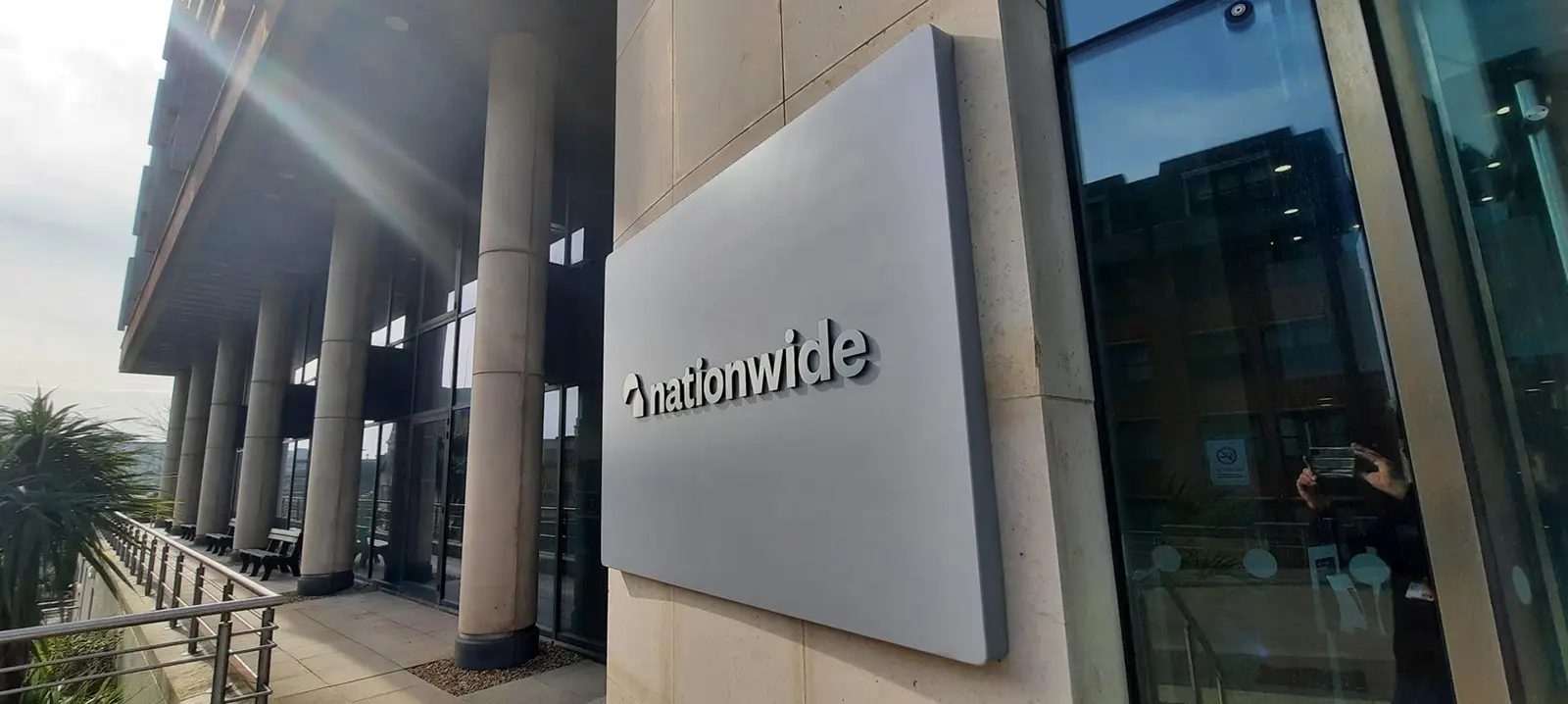 A building with large columns and a sign reading "nationwide" on the wall.