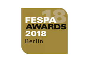 FESPA Awards 2018 logo featuring bold white and black text on a gold background with "Berlin" at the bottom; highlights international printing industry event branding.